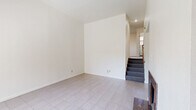 Located at 4763 Appian Way in El Sobrante, California, this multi-story residence offers three bedrooms, three bathrooms, and a thoughtfully laid-out floor plan spread across three levels. Light-toned tile flooring runs consistently throughout the home, giving it a clean, cohesive look.

The main living area is bright and open, featuring a granite-surround fireplace and a large window that invites natural light and views of the surrounding greenery. A dedicated entry door adds a welcoming touch. The kitchen is well-appointed with warm wood cabinetry, dark granite countertops, white appliances including a refrigerator, electric range, and dishwasher, and a sliding glass door that opens to additional natural light.

The generously sized primary bedroom includes multiple closets—two bi-fold and one standard door—providing ample storage. Additional bedrooms are comfortably proportioned, each with windows offering garden views and baseboard heating. The bathrooms are functional and consistent in design, featuring wood vanities, granite countertops, tile flooring, and overhead storage cabinets. The connected bathroom layout offers convenient access between rooms.

Baseboard heating is found throughout the home, ensuring comfort year-round. The multi-level layout offers a practical separation of living, sleeping, and utility spaces, making this residence well-suited for everyday living.