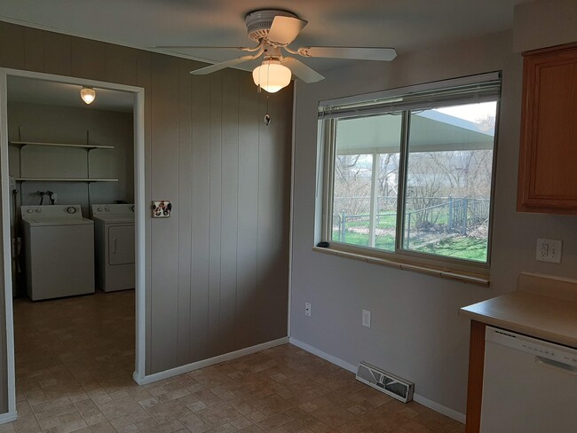 Eat in kitchen. Doorway to laundry and access to your private yard. - 1275 Moore St