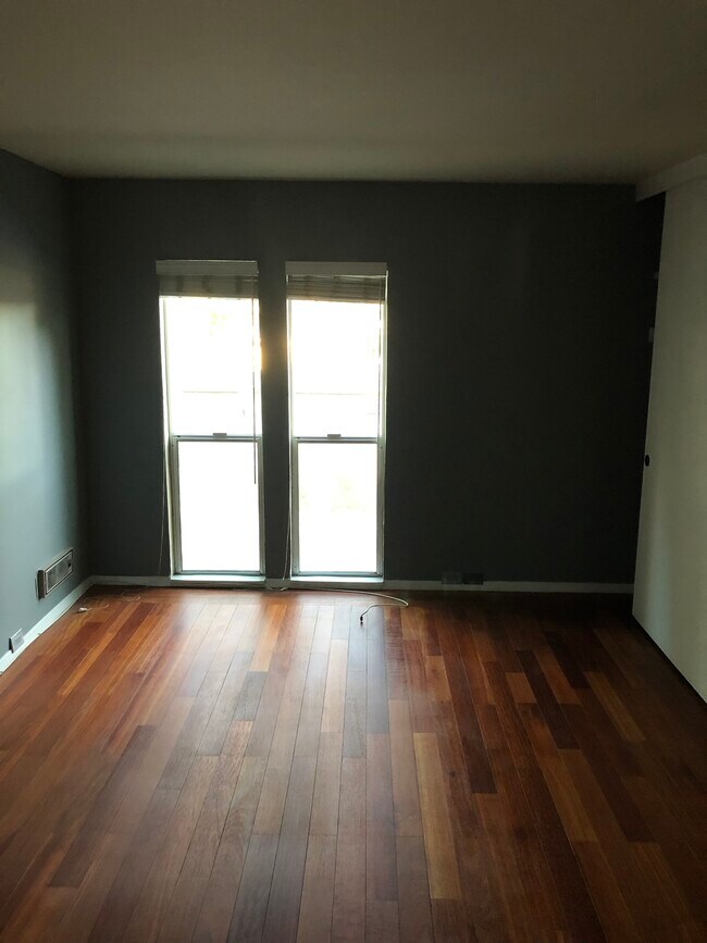 Kemp’s hardwood flooring in bedroom view. - 155 Sharene Ln