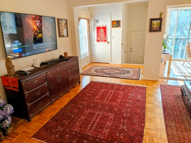 Large smart TV in a roomy living room - 106 Siena Way