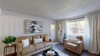 Located at 2593 Millcreek Dr in Sacramento, CA, this single-story, one-bedroom, one-bathroom unit offers a well-organized layout across a compact yet functional floor plan. Wood-style flooring runs throughout the unit, providing a cohesive look and easy maintenance.

The combined kitchen and living room area serves as the heart of the home. The kitchen features warm oak cabinetry, a white refrigerator, a double sink positioned beneath a window, and ample counter space. A ceiling fan overhead adds airflow to the space. The adjoining living area is bright and inviting, with large sliding glass doors and windows that bring in generous natural light and provide access to an outdoor area.

The bedroom is a comfortable retreat, featuring a window with views of surrounding greenery, a sliding-door closet for storage, and a textured ceiling found throughout the unit. A versatile office space includes its own sliding-door closet, making it adaptable for various needs.

The full bathroom is well-appointed with a tub-shower combination, a vanity with a speckled countertop, wood-toned cabinetry, and floating wall shelves for additional storage. Dark wood-style flooring ties the bathroom together with the rest of the unit. A dedicated dining area near the kitchen completes this thoughtfully arranged home.