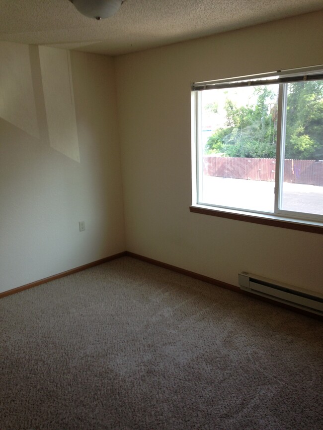 Bedroom With Window - Dodge House Apartments