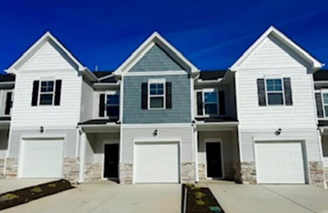 Building Photo - SPECIAL PRICING NOW! NEW TOWNHOMES ACROSS ...