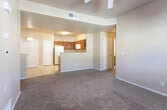 Located at 9435 Diana Dr in El Paso, Texas, this single-story residence offers a practical and comfortable layout throughout. The living area is generously sized, featuring plush carpeting, a ceiling fan with light fixture, and a front entry door that welcomes natural light into the space. A hallway connects the main living area to the bedrooms and bathrooms, providing a well-organized flow.

The kitchen is a standout feature, equipped with warm-toned solid wood cabinetry offering ample upper and lower storage, light-colored countertops, and white appliances including a refrigerator, range, and over-the-range microwave. A peninsula with a half-wall separates the kitchen from the living area, and tile flooring throughout the kitchen provides easy maintenance. Multiple pantry and storage closets are accessible directly from the kitchen.

The bedrooms are comfortably sized, each featuring soft carpeting, ceiling fans, and windows with blinds that allow natural light while maintaining privacy.

The bathrooms are clean and functional, each featuring a tub-shower combination with tiled surrounds, tile flooring, and one bathroom includes a wood-cabinet vanity with a single sink and large mirror. The overall aesthetic of the home is neutral and move-in ready.