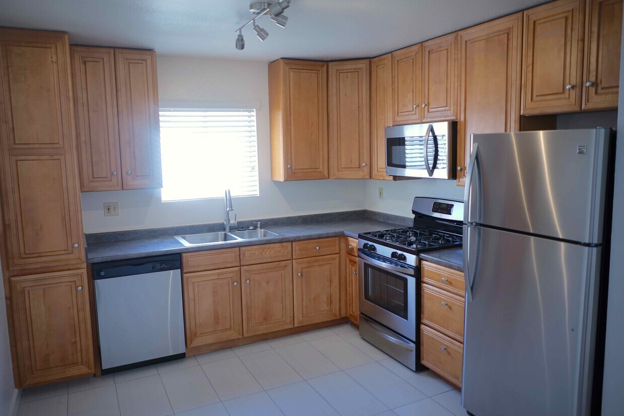 Kitchen has been updated with granite countertops and stainlesds appliances. - 3038 E St
