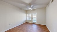 Located at 4401 Thornton St in Fort Worth, TX, this single-story, 4-bedroom, 2-bathroom home offers a practical and comfortable layout. The open living room features warm wood-look flooring, a ceiling fan with light fixture, and a glass door flanked by windows that invite natural light and provide outdoor views. The kitchen is well-equipped with warm-toned wood cabinetry, black appliances including a refrigerator, range, and microwave, white countertops, and a stainless steel double sink. A pantry provides additional storage, and hardwood-style flooring continues throughout. A hallway with carpet connects the bedrooms and bathrooms, offering a smooth transition between living and private spaces. The bedrooms feature a mix of wood-look and carpeted flooring, ceiling fans, and ample natural light through blinded windows, with five closets distributed throughout the home for generous storage. The bathrooms are clean and functional, with one featuring a wide vanity, white countertop, large mirror, and wood-look flooring. A dedicated laundry area and entrance add everyday convenience. The neutral color palette and clean finishes throughout give the home a bright, move-in-ready feel.