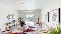 Located at 2120 W A St in Pasco, WA, this thoughtfully designed 2-bedroom, 2-bathroom residence offers a clean, modern aesthetic throughout its comfortable single-floor layout. Light wood-style flooring flows seamlessly across the living spaces, complementing the bright white walls and creating a warm, contemporary ambiance.

The living room serves as the heart of the home, featuring a sliding glass door that opens to a private balcony with open outdoor views, allowing natural light to fill the space. The kitchen is a standout feature, boasting rich dark shaker-style cabinetry, light quartz countertops, a subway tile backsplash, black appliances, and recessed lighting — a well-equipped space ideal for everyday cooking.

The spacious primary bedroom offers a peaceful retreat with a natural window view, soft neutral tones, and generous proportions. The second bedroom is equally well-sized and bright. Both bathrooms are finished with dark vanity cabinetry, light countertops, and wood-style flooring, maintaining a consistent design language throughout. A dedicated closet provides added storage convenience. The overall atmosphere is clean, modern, and move-in ready, making this residence a functional and stylish home in Pasco, Washington.