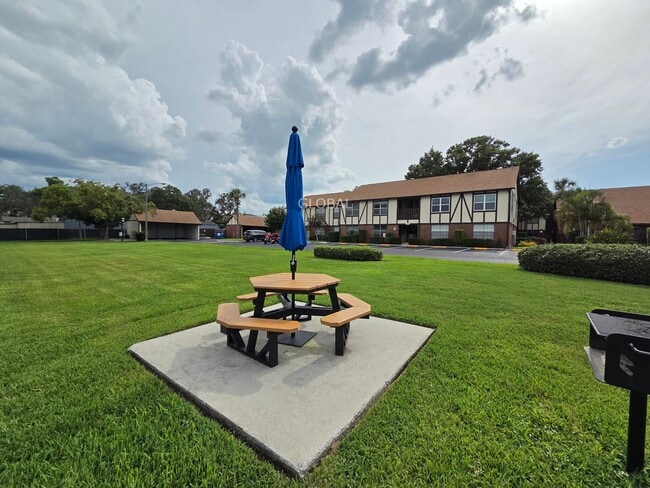 Building Photo - Lakefront First-Floor Condo in Camelot by ...