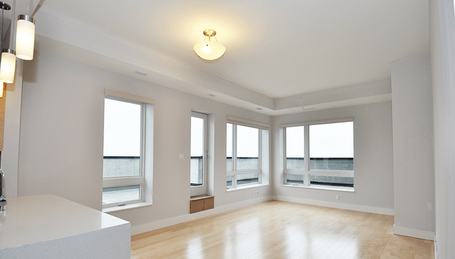 The Plaza Living Room View With Balcony - The Plaza at Forest Hills