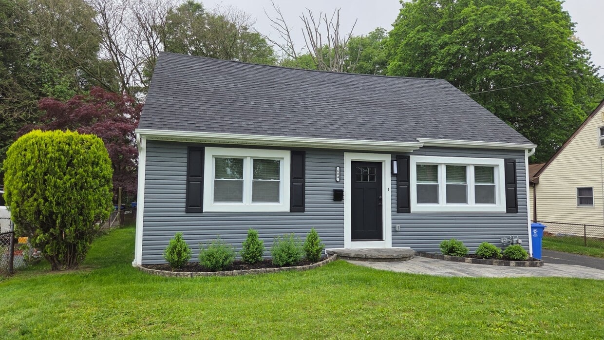 The front of the house has been beautifully updated for both style and durability. Featuring a brand - 604 Holly Ln
