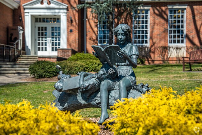 Statue of children reading at the Glen Rock Public Library in Glen Rock.