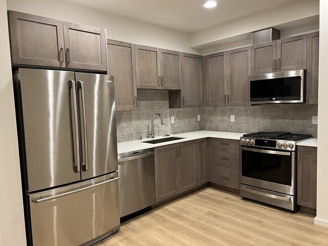 Kitchen: Quartz countertops and stainless-steel appliances - 3631 1st Ave NW