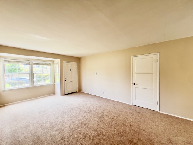 Living room and front bay window - 5220 E Broadway