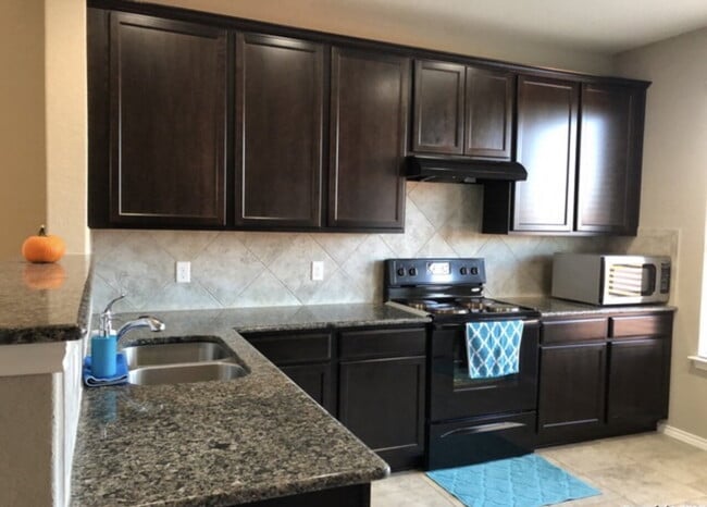 Building Photo - "Spacious 4-Bedroom Retreat with Granite Countertops & Private Movie Room in Selma, TX!"