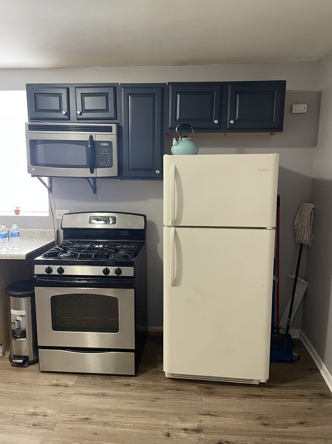 Kitchen: stove and fridge - 1401 W 47th St