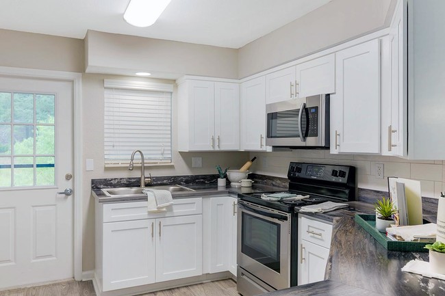 Our open layout kitchens include stainless steel appliances; refrigerator, stove, dishwasher and microwave. - Emerson Isles II