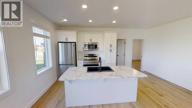 Photo du bâtiment - 12018-12077 77 Ave