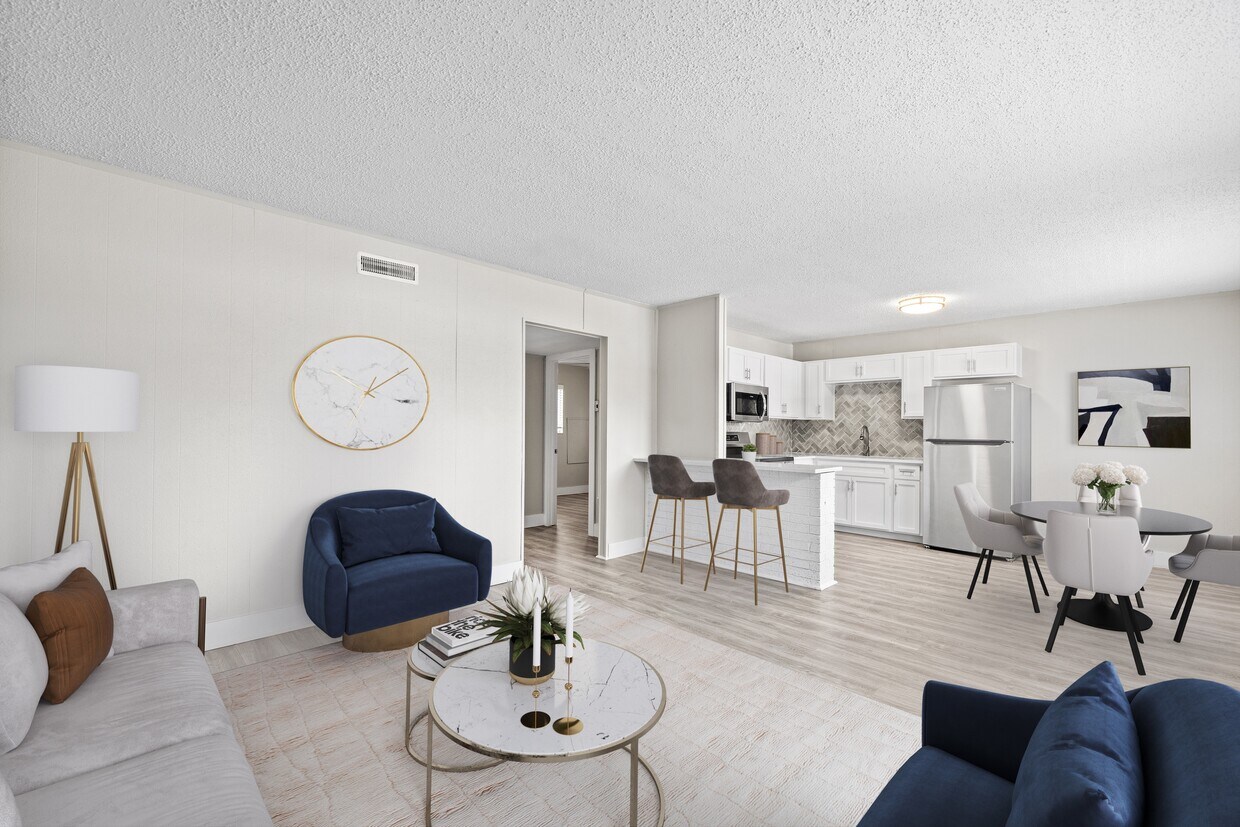 Relájese en un espacio de estar abierto y luminoso diseñado para la comodidad moderna. - The Lynx Townhomes and Apartments