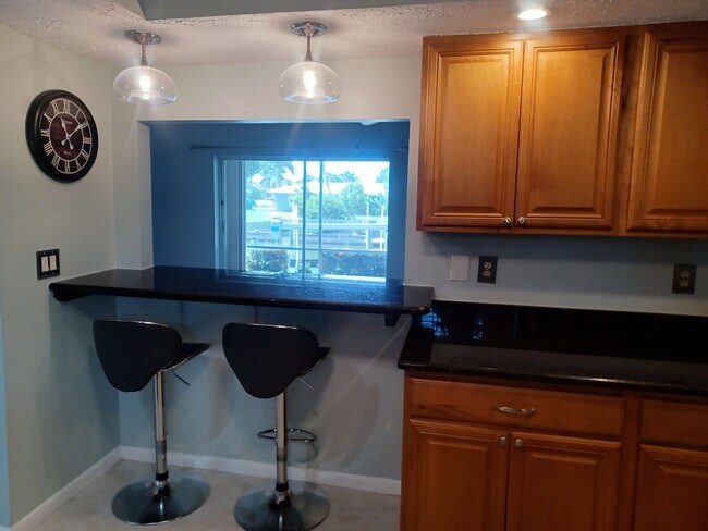 Building Photo - UPGRADED WATERFRONT END UNIT 3 BR / 2 BA Home With BOAT LIFT/ DOCK & OUTSTANDING VIEWS