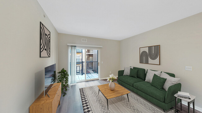 Newly Renovated Living Room with Hardwood-Style Flooring - The Chelsea Apartments