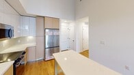 This 910 square foot apartment in North Miami offers a blend of comfort and tropical living. Located at Unit 101 - B1 in the 33181 zip code, the single-story residence boasts 4 bedrooms and 2 bathrooms. The primary bedroom, spanning 150 square feet, provides ample space for relaxation.

The modern kitchen is a highlight, featuring sleek white and wood cabinetry, stainless steel appliances, and a convenient island. High-end finishes include under-cabinet lighting and a stylish backsplash. The bathrooms showcase contemporary design with glass shower enclosures, marble-like tiling, and floating vanities.

Throughout the apartment, hardwood floors add warmth and elegance. The living spaces are bright and airy, with recessed lighting and high ceilings contributing to the open feel. Storage is plentiful, with walk-in closets and additional built-in shelving.

A standout feature is the lush tropical courtyard, visible from private balconies. Palm trees, vibrant flora, and manicured pathways create a resort-like atmosphere. The complex appears to offer additional amenities, enhancing the overall living experience in this North Miami gem.