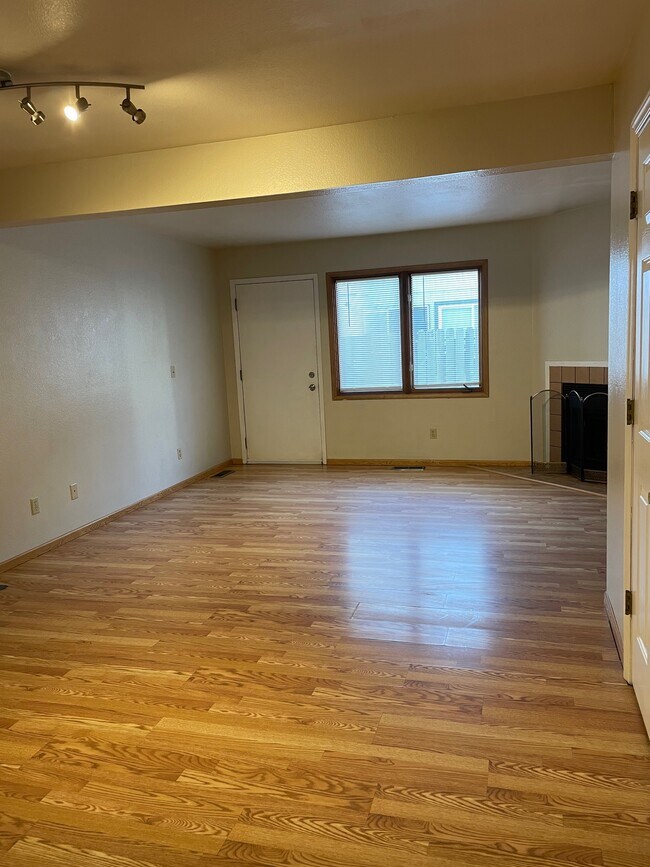 View of living room and back door - 4051 E 20th Ave