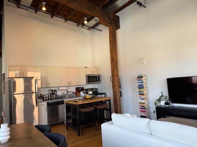 #401 LIVING/ KITCHEN AREA - Brass Building Lofts