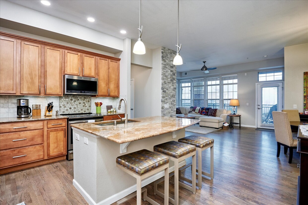 Recessed lighting with dimmers.10 ft ceilings. Kitchen with stainless steel appliances - 7820 Inverness Blvd