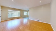Located at 3910 Coco Ave. in Los Angeles, CA, this well-appointed single-floor unit offers three bedrooms, three bathrooms, and a thoughtfully designed layout. Warm bamboo-style hardwood flooring flows throughout the main living areas and bedrooms, creating a cohesive and inviting atmosphere.

The open living room is bright and airy, featuring recessed lighting, a ceiling fan, and large windows dressed with blinds that allow generous natural light to fill the space. The kitchen is efficiently designed with white shaker cabinetry, granite countertops, stainless steel appliances including a refrigerator and dishwasher, and light tile flooring—offering both style and practicality.

Each bedroom is comfortably sized, with the primary bedroom featuring built-in sliding closets with upper cabinetry, providing ample storage. Additional bedrooms also include built-in closet systems with the same clean, white finish. Recessed lighting and neutral wall tones keep each room feeling bright and versatile.

The bathrooms are finished with tile flooring and tasteful fixtures. One bathroom showcases a marble-top vanity with brushed nickel hardware, while another includes a tiled walk-in shower. Three connecting hallways provide a practical flow between all rooms, completing this functional and well-maintained Los Angeles residence.