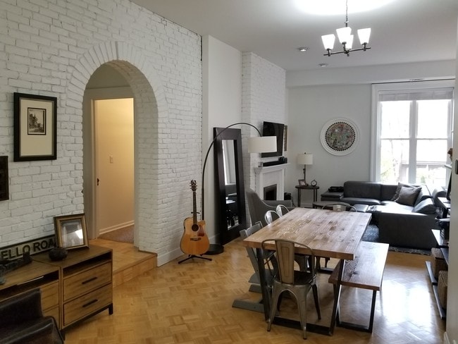 large, open floor plan with exposed brick - 1 Linden Pl