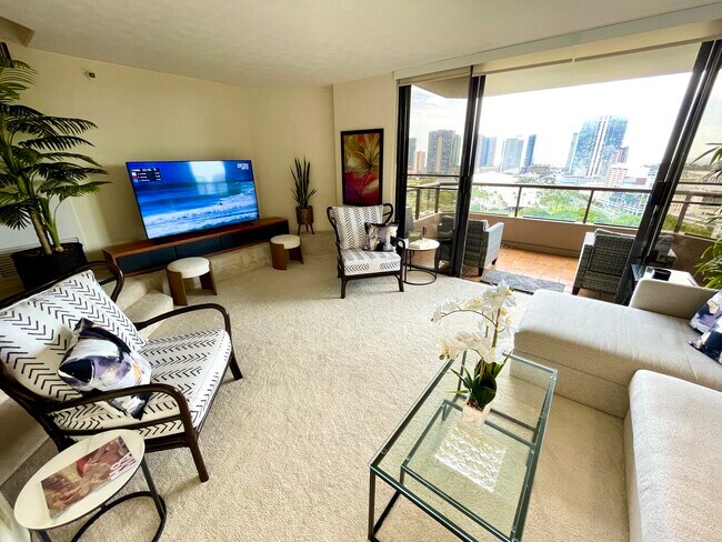 A second view of entertainment area with 65" TV - 1221 Victoria St