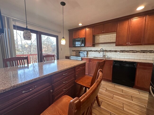 Kitchen with a deck view - 337 E 2nd St