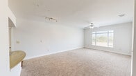 Located at 1300 Placid Cir in Waco, TX, this single-floor, 2-bedroom, 1-bathroom residence offers a thoughtfully designed layout that maximizes comfort and functionality. The open-concept living area is bright and airy, with large windows that invite generous natural light and views of the surrounding outdoors. Plush wall-to-wall carpeting and ceiling fans are featured throughout the living and bedroom spaces, contributing to a warm and comfortable atmosphere.

The kitchen is a standout feature, showcasing rich dark cabinetry with brushed nickel hardware, granite-style countertops, and black appliances including a range, microwave, and refrigerator. A curved breakfast bar peninsula connects the kitchen to the living area, enhancing the open feel. Wood-look flooring anchors the kitchen and dining zone, providing a clean contrast to the carpeted spaces. A dedicated pantry or utility closet adds convenient storage.

The spacious primary bedroom is filled with natural light from a wide window and includes a ceiling fan and access to a generous walk-in closet with built-in shelving. The second bedroom is equally well-lit with its own ceiling fan. The bathroom features wood-look flooring, dark vanity cabinetry with granite-style counters, a glass-enclosed shower, and wall-mounted storage. A connecting hallway ties all rooms together efficiently.