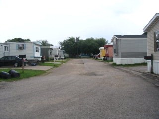 Building Photo - Angleton Oaks Mobile Home Village