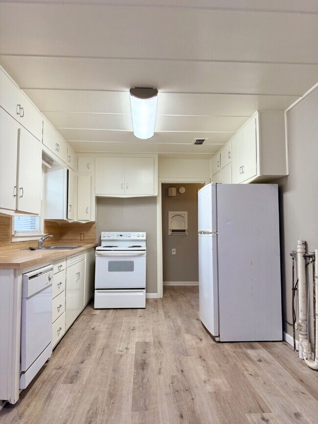 Building Photo - Fresh Paint, New Floors, and a Fresh Start!