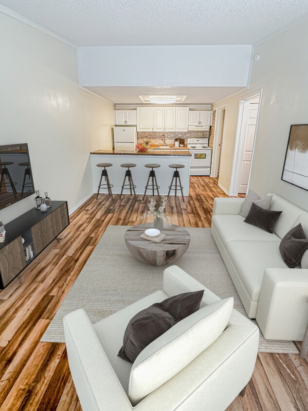 Ingrese a amplias salas de estar diseñadas con grandes ventanas y paletas de colores versátiles, listas para complementar su estilo personal. - Beach Bluff Apartments