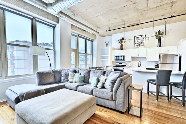 Large windows, open layout, tons of natural light, large living area with sectional couch - 6 S Laflin St