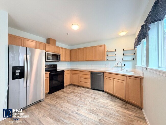 Building Photo - Spacious 4-Bedroom Townhome in Alicia Meadows | Garage, Patio & Pet Friendly