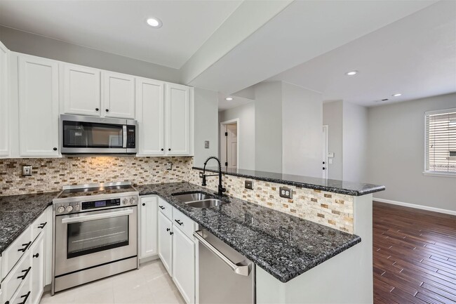 Building Photo - Evolve Real Estate: Updated Townhome Nestl...
