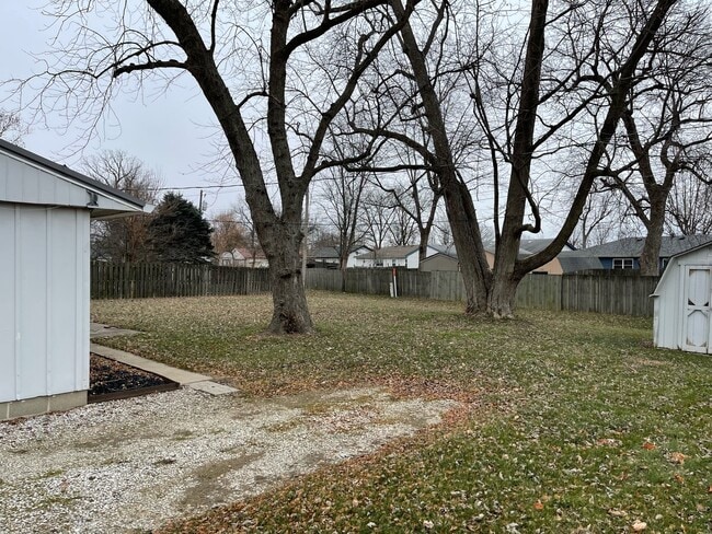 Back yard from driveway - 1509 Jaques Dr