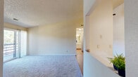 Located at 742 Western Dr in Colorado Springs, CO, this single-floor, one-bedroom, one-bathroom home offers a functional and comfortable layout. The open combined kitchen and living area serves as the heart of the home, featuring hardwood-style flooring in the kitchen, white cabinetry, stainless steel appliances including a refrigerator, range, and dishwasher, and ample counter space. The living room is carpeted and highlighted by a tile-surround fireplace with a white mantel, a wall-mounted mini-split unit for climate control, and a sliding glass door that opens to a private patio with outdoor views. A separate dining room provides additional flexibility for everyday living. The bedroom offers plush carpeting, a textured ceiling, a window with natural light, and direct access to a closet. The full bathroom includes a tiled tub-shower combination and built-in shelving for storage. Throughout the home, textured ceilings, neutral wall tones, and a mix of carpet and hard-surface flooring create a cohesive, move-in-ready aesthetic. In-unit laundry and two closets add practical convenience to this well-appointed Colorado Springs residence.