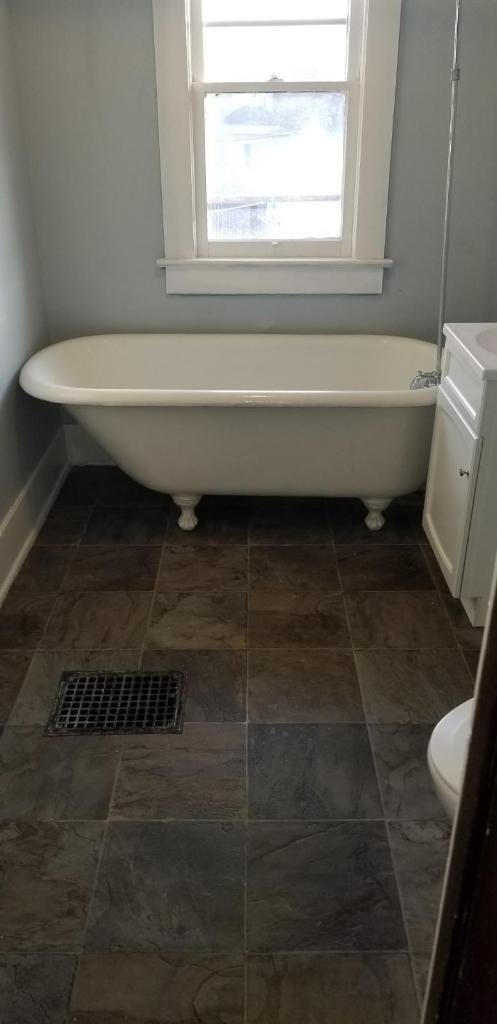 Newly renovated bathroom with original tub (shower head also installed)! - 215 N 19th St