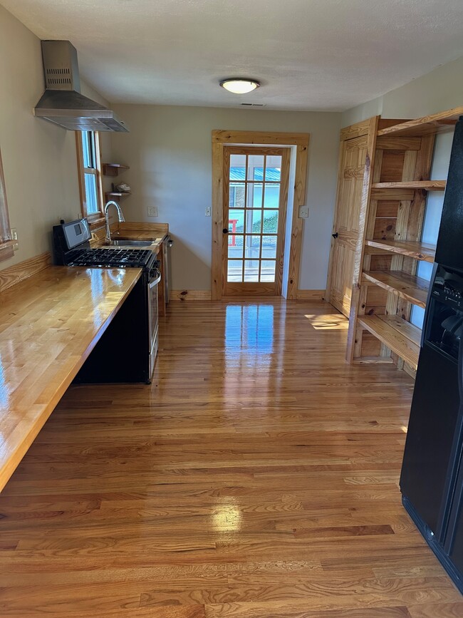 Kitchen, opens to sun room - 295 Carrie Ln