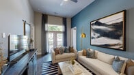 Located at 7420 N Rea Park Ln in Charlotte, NC, this thoughtfully designed 2-bedroom, 3-bathroom residence offers a refined single-floor layout with impressive architectural details throughout. The open-concept living room features soaring ceilings, rich hardwood-style flooring, a sliding barn door accent, and large windows and French doors that invite abundant natural light and outdoor views. A bold accent wall adds a striking focal point to the generous living area. The gourmet kitchen is a standout, showcasing quartz countertops, white shaker cabinetry, stainless steel appliances, under-cabinet lighting, pendant lights, and a large island with a stainless steel sink — ideal for cooking and entertaining. The primary bedroom offers a serene retreat with plush carpeting, while its en-suite bathroom impresses with marble-look tile flooring, a glass-enclosed shower, and direct access to a well-appointed walk-in closet with built-in shelving. The secondary bedroom benefits from a large window with outdoor views and its own closet. A second full bathroom features a soaking tub, marble-look tile, and dual-sink vanity. Two dedicated closets further enhance storage throughout the home.