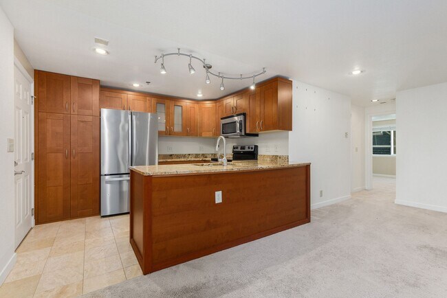 Building Photo - Updated Cap Hill Bedroom with 1 reserved p...