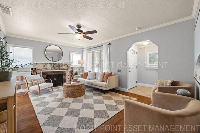 Building Photo - Welcome to this stunning 4-bedroom, 2-bath...