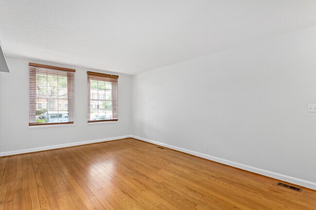 Living room w/ fresh paint, HW floors, natural light, & blinds - 4218 35th St S