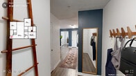 Located at 1400 East Cornwallis Road in Durham, NC, this single-floor, three-bedroom, three-bathroom home offers a well-organized layout across a comfortable footprint. The open-concept kitchen and living area serves as the heart of the home, anchored by a bold steel-blue accent wall that carries throughout the space. The kitchen features warm honey-toned wood cabinetry, ample upper and lower storage, a full suite of white appliances including a refrigerator, electric range, and microwave, as well as a double sink and generous counter space. The adjoining living room benefits from natural light through a large window, a ceiling fan, and a relaxed, welcoming ambiance. Wood-style plank flooring flows through the main living areas, transitioning to plush carpet in each of the three bedrooms. The primary bedroom offers a comfortable scale with a window that brings in natural light. Each of the three bathrooms includes a tub-shower combination, a wood-vanity with white countertop, and tile flooring. A central hallway connects the bedrooms and living spaces, and three dedicated closets provide ample storage throughout. The textured ceilings and neutral white walls throughout complement the distinctive blue accent, creating a cohesive, modern aesthetic.