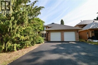 Building Photo - 104 Woodbend Crescent