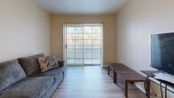 Located at 3280 N Downing St in Denver's vibrant Cole neighborhood, this two-bedroom, one-bathroom residence offers a practical and well-organized single-floor layout. Hardwood-style flooring runs throughout, lending a clean and cohesive look to the entire space.

The living room is bright and inviting, featuring a large sliding glass door that opens to a private balcony and fills the room with natural light. Adjacent to the living area, the kitchen features warm honey-toned oak cabinetry, white appliances including an electric range, a single-basin sink, and a pass-through window to the dining area — ideal for everyday functionality. A skylight above the kitchen adds additional brightness.

The primary bedroom is a comfortable, well-proportioned retreat with a window overlooking the outdoors and a closet for storage. The second bedroom mirrors this layout with its own natural light source, a built-in double closet, and hardwood-style flooring. Three closets in total are distributed throughout the unit, providing generous storage options.

The full bathroom features matching light wood-tone flooring with clean, neutral-toned walls. A central hallway connects all rooms efficiently. With a balcony, multiple closets, and a natural light-filled layout, this Denver residence offers practical comfort in a well-connected urban location.